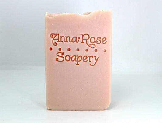 Light pink bar soap on a white background.