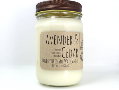 White wax candle in a mason jar with a rustic brown metal lid. Kraft brown label with black text. White background.
