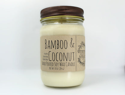 White wax candle in a mason jar with a rustic brown metal lid. Kraft brown label with black text. White background.