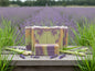 Bars of soap with a marbled pattern and 'Wildflower & Willow' branding in a field of lavender