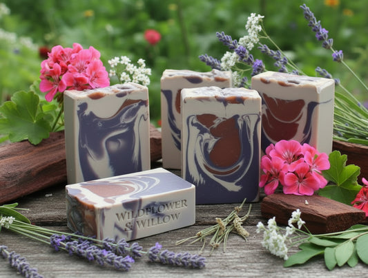 multicolored soap on awooded background with flowers