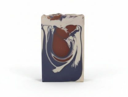 Marbled soap bar with brown, purple, and white design on a white background