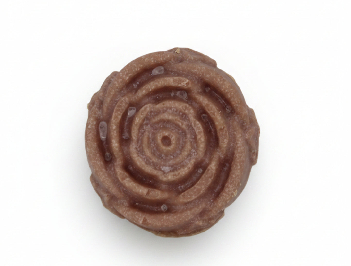 Mauve rose-shaped soap on a white background