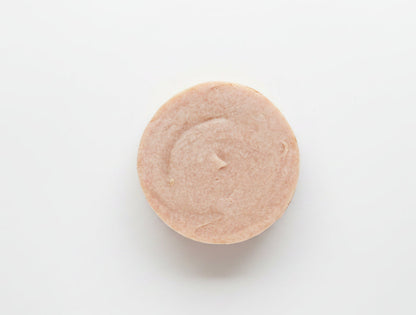 Round orange soap on a white background