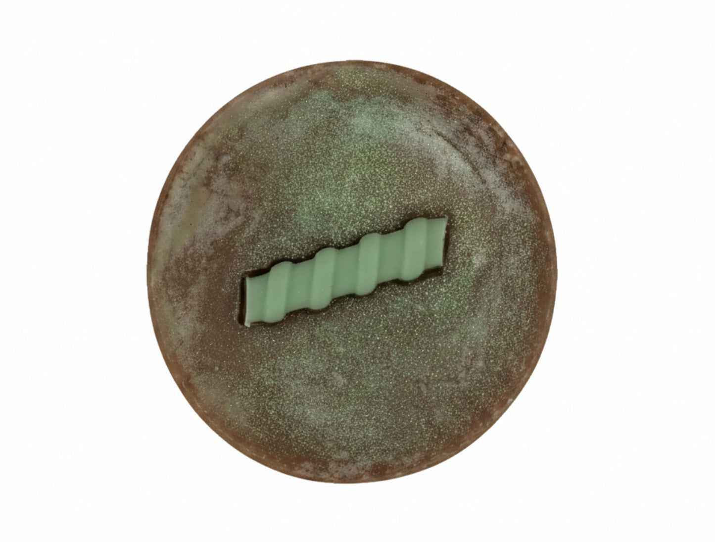 round brown bar of soap on a white background