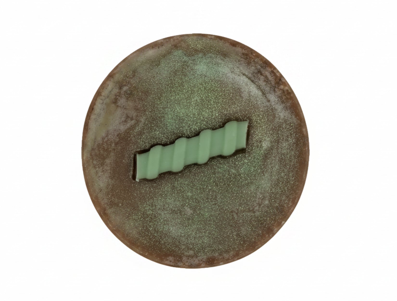round brown bar of soap on a white background