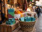 Handmade layered soap bars with a wavy, rustic top edge, featuring horizontal bands of teal blue, lime green, and deep red.