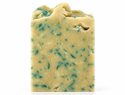 A bar of cream and blue colored soap on a white background